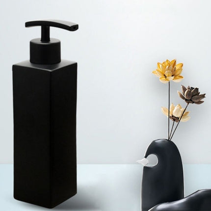 Svart såpedispenser i rustfritt stål