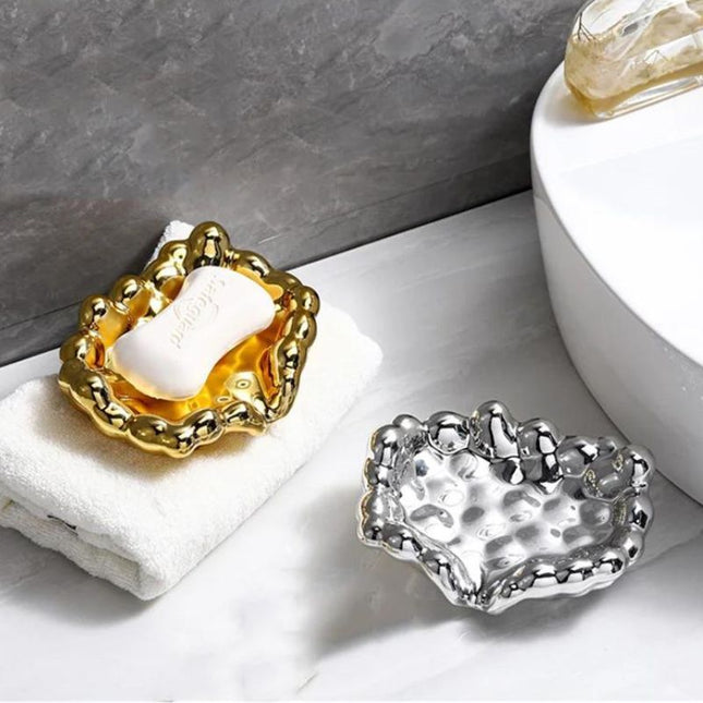 Design såpeholder i gullfarget skyform