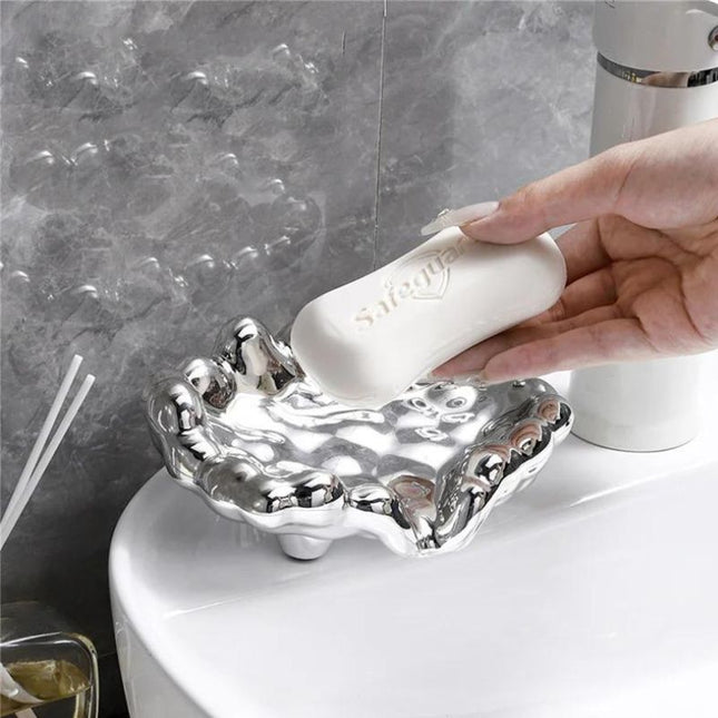 Design såpeholder i gullfarget skyform