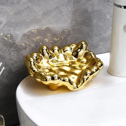 Design såpeholder i gullfarget skyform