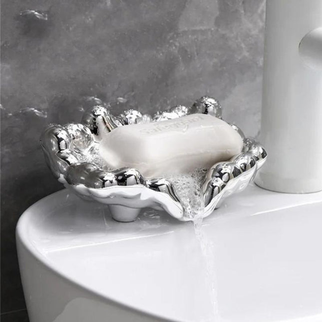 Design såpeholder i gullfarget skyform