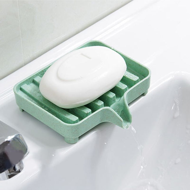 Selvdrenerende såpekopp i plast for vask