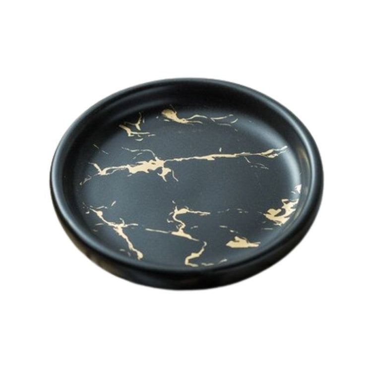 Rundt såpefat med svart marmorlook