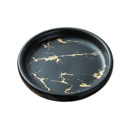 Rundt såpefat med svart marmorlook