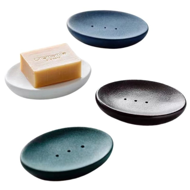 Hvit oval såpeholder med dreneringshull