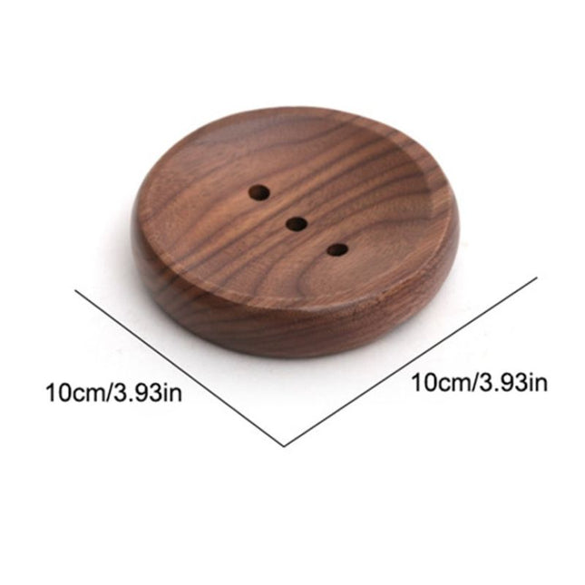 Rundt såpefat i mørkt tre