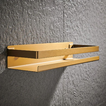 Stilren gullfarget dusjhylle for badet