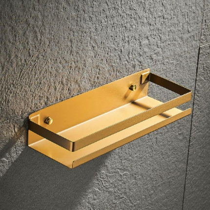 Stilren gullfarget dusjhylle for badet